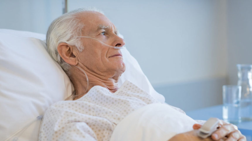 Image of a senior man recuperating in a hospital bed