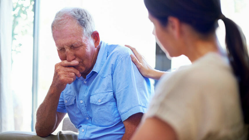 A devastated senior man dealing with some terrible news